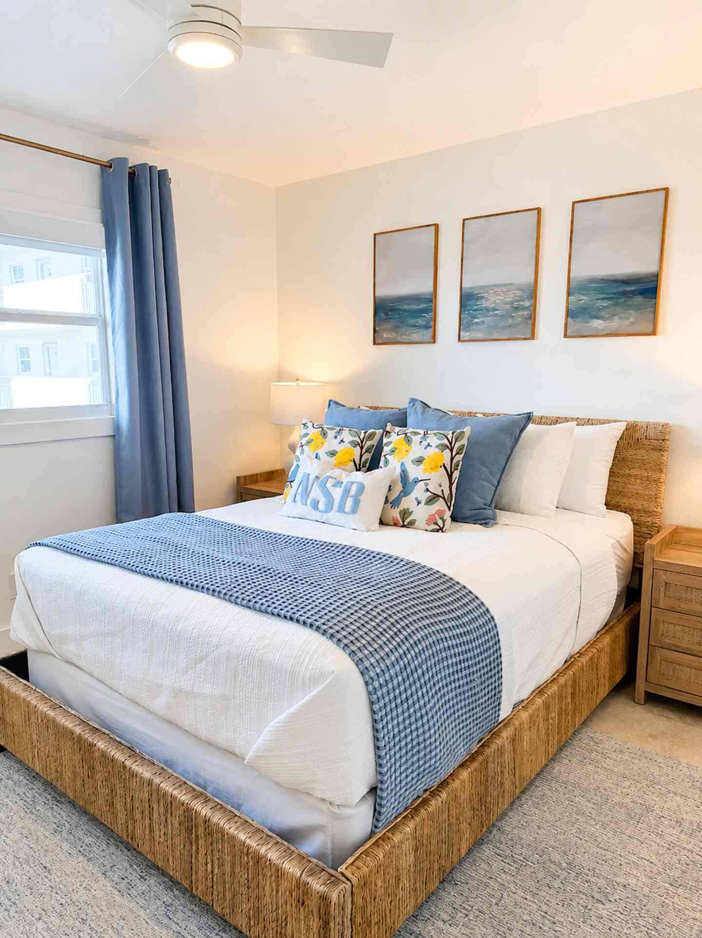 Cozy oceanfront bedroom with sea-themed decor and natural light at Salt & Vine.