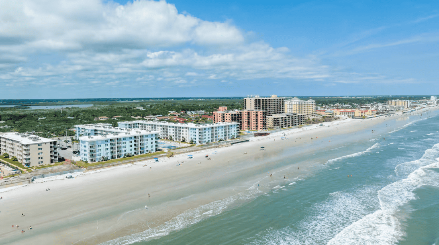 Aerial view of the sandy shoreline and Atlantic Ocean in New Smyrna Beach, Florida